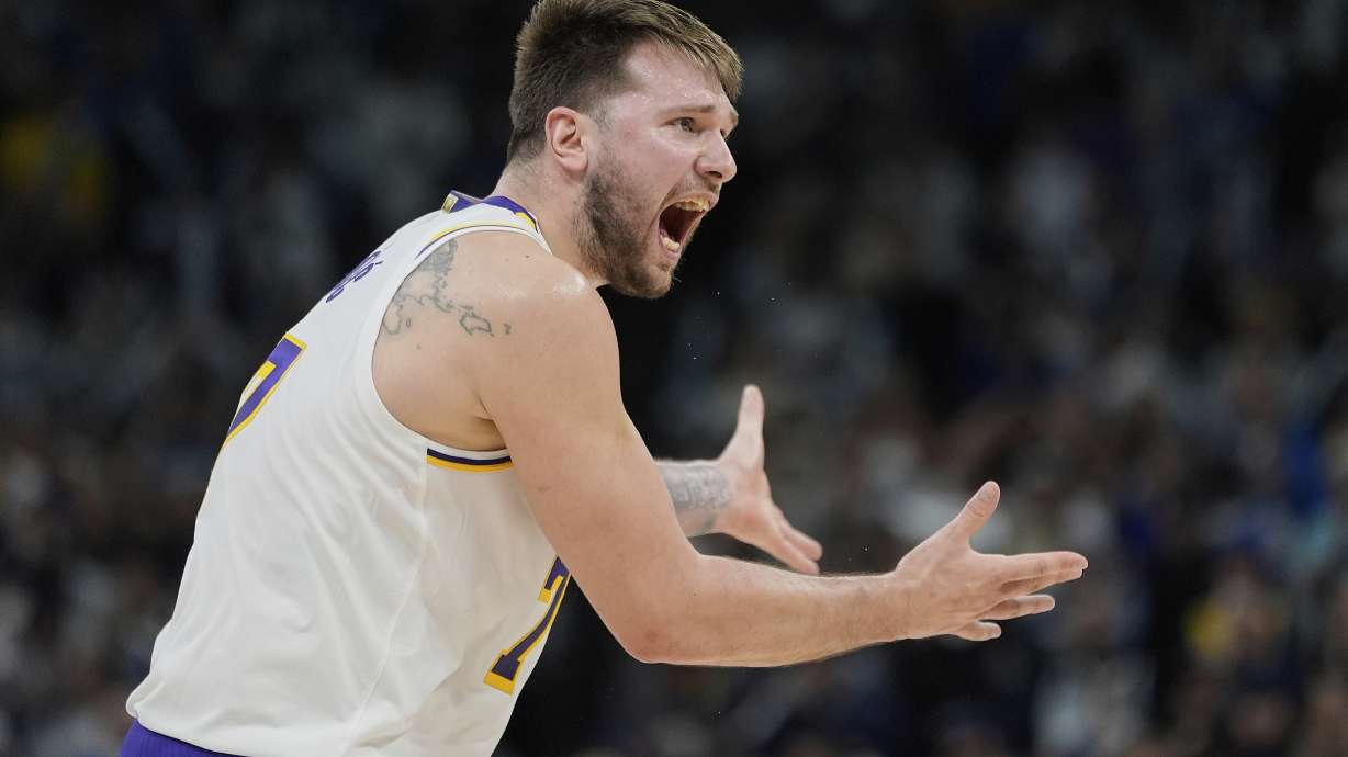 Los Angeles Lakers guard Luka Doncic (77) reacts after a foul called on the Lakers during the first half of Game 4 of an NBA basketball first-round playoff series against the Minnesota Timberwolves, Sunday, April 27, 2025, in Minneapolis.