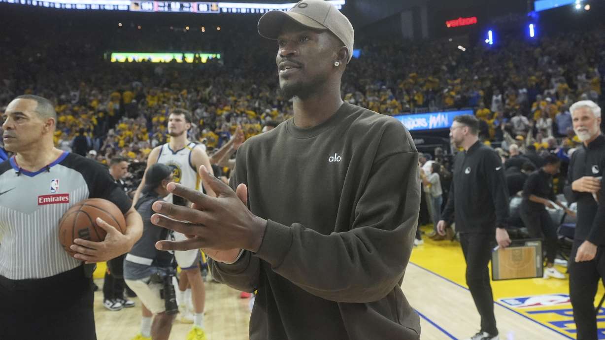 Injured Golden State Warriors forward Jimmy Butler III walks on the floor after Game 3 of an NBA basketball first-round playoff series against the Houston Rockets in San Francisco, Saturday, April 26, 2025.