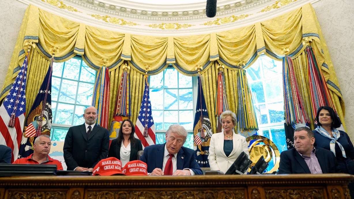 President Donald Trump signs an executive order April 23 in Washington. Congressional Republicans commemorate the first 100 days of President Donald Trump's second term.