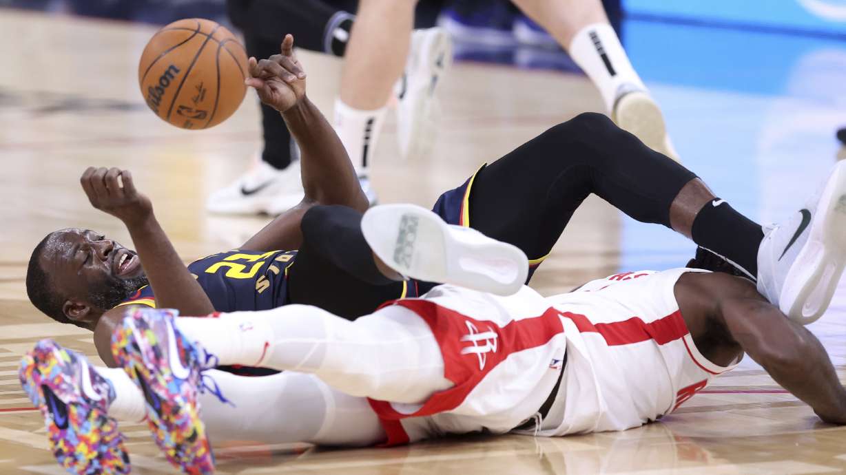 Golden State Warriors' Draymond Green tangles with Houston Rockets' Tari Eason during the first half in Game 4 of an NBA basketball first-round playoff series in San Francisco, on Monday, April 28, 2025.