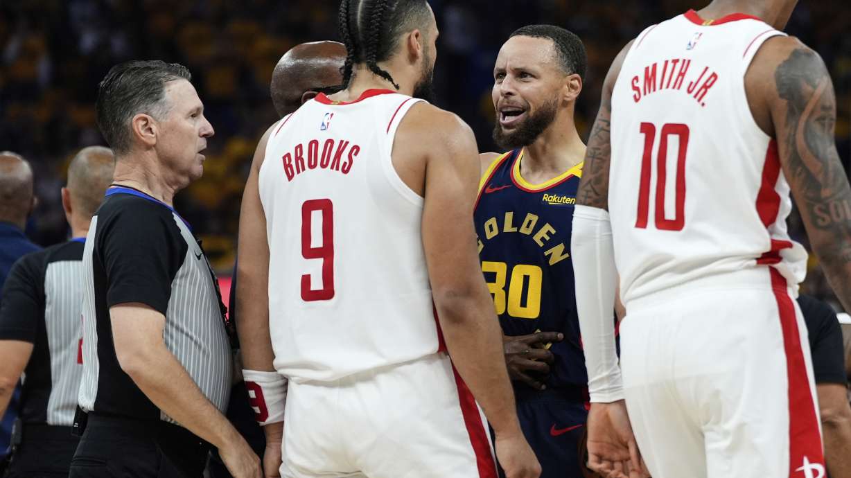Golden State Warriors guard Stephen Curry (30) confronts Houston Rockets forward Dillon Brooks (9) during the first half of Game 4 of an NBA basketball first-round playoff series Monday, April 28, 2025, in San Francisco.