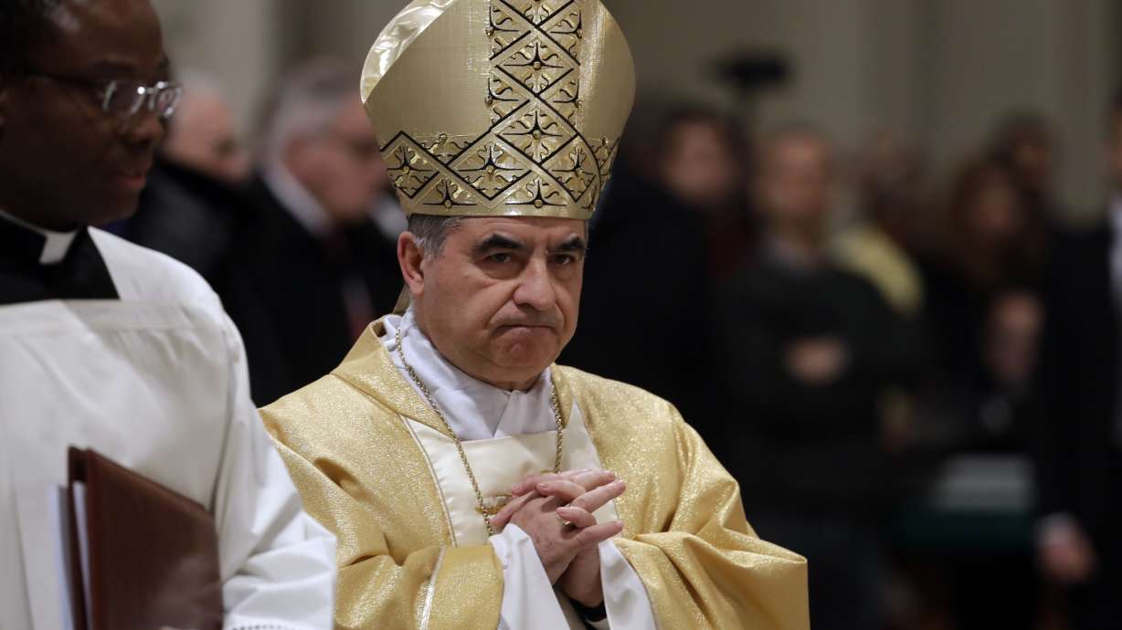 Mons. Angelo Becciu presides over an eucharistic liturgy, at the St. John in Latheran Basilica, in Rome, Feb. 9, 2017. He announced Tuesday he was withdrawing from the upcoming conclave to elect a new pope.