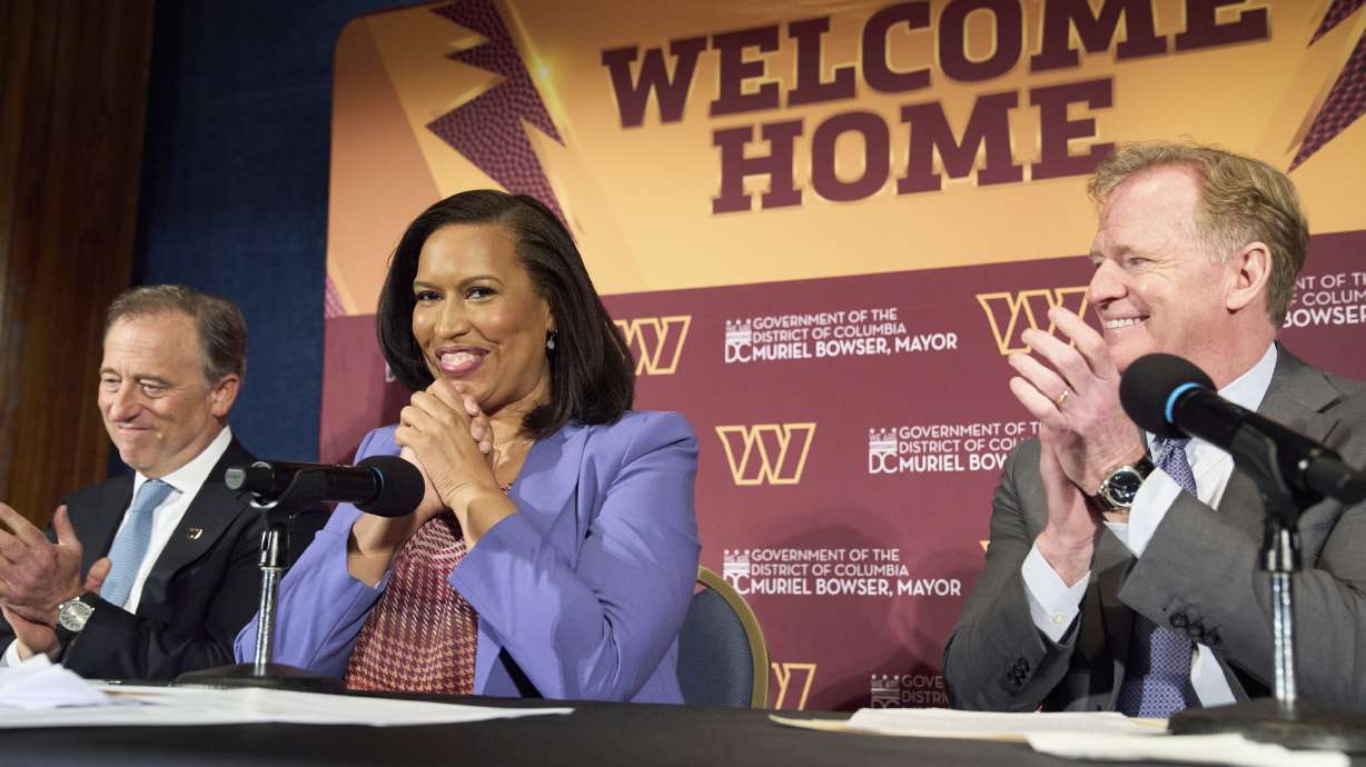 Washington Commanders controlling owner Josh Harris, from left, District of Columbia Mayor Muriel Bowser and NFL Commissioner Roger Goodell announce a new home for the NFL football team on the site of the old RFK Stadium, Monday, April 28, 2025, at the National Press Club in Washington.
