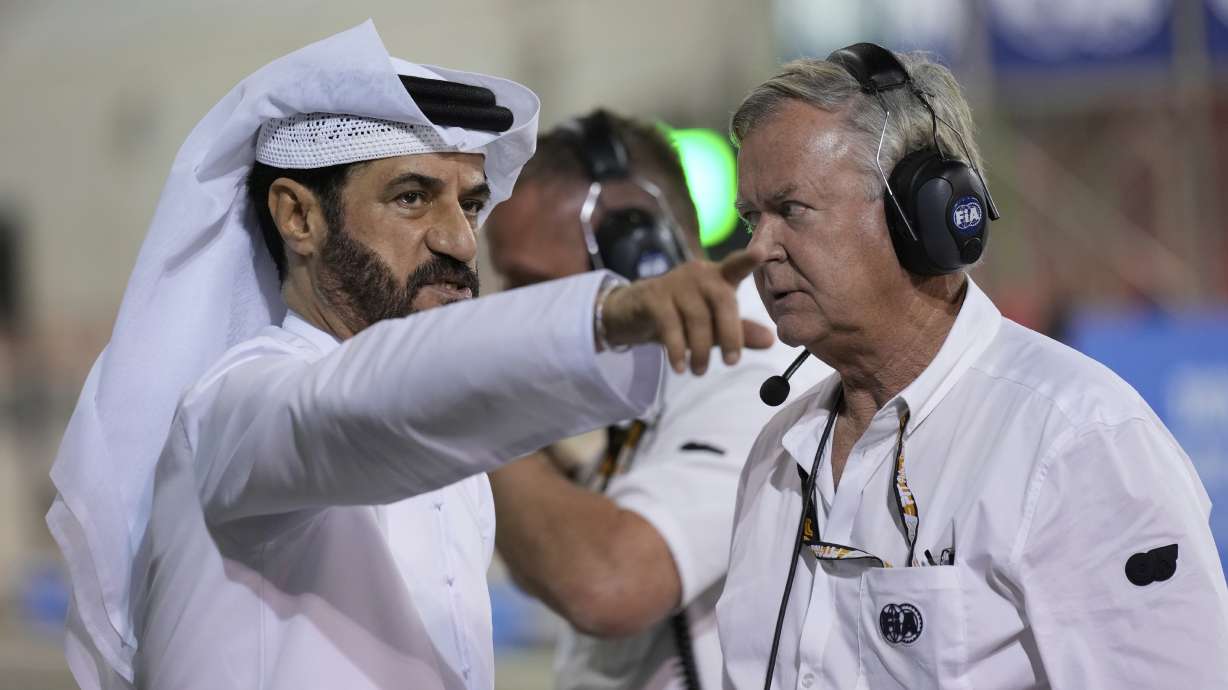 FIA President Mohammed Ben Sulayem talks to a race official during the qualifying for the Formula One 2025 Bahrain Grand Prix, in Sakhir, Saturday, April 12, 2025.