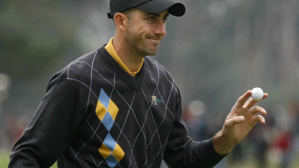 FILE - International Presidents Cup team player Geoff Ogilvy, from Australia, gestures after winning the second hole of his singles match against United States' Steve Stricker at the Presidents Cup at Harding Park Golf Course, Sunday, Oct. 11, 2009, in San Francisco.
