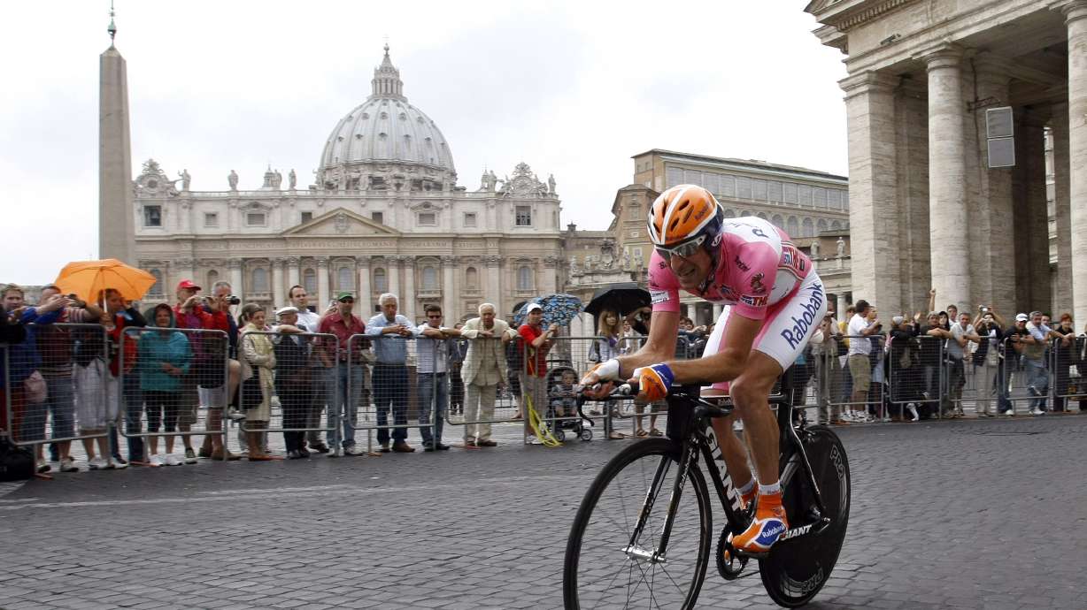 FILE - Russia's Denis Menchov pedals past St. Peter's Basilica, during the last stage of the Giro d'Italia, Tour of Italy cycling race, an individual time trial in Rome, May 31, 2009.