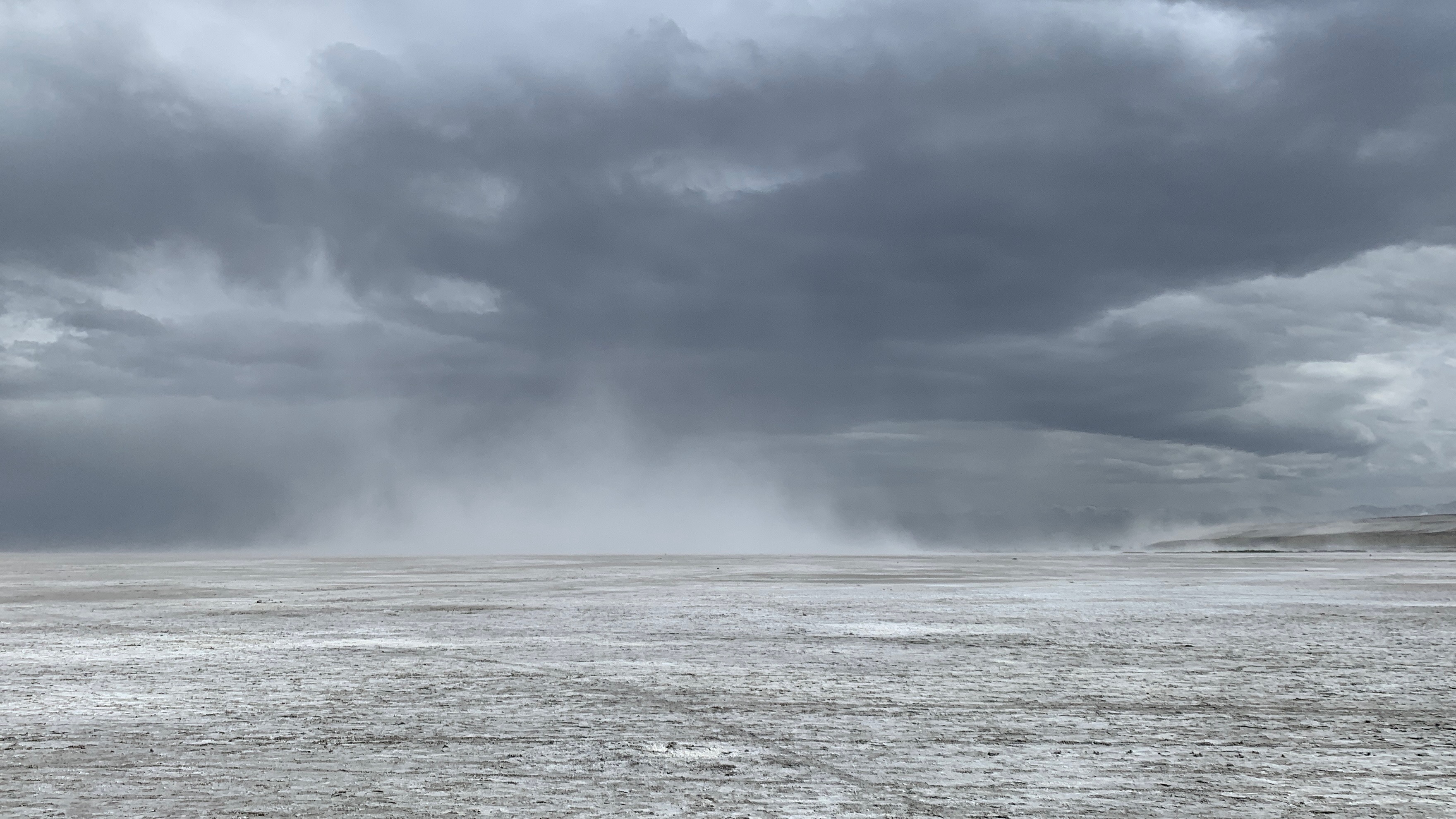 Dust flies off the Great Salt Lake on Sunday. Environmental groups warn that despite the increase this spring, the lake is still prone to dust storms.