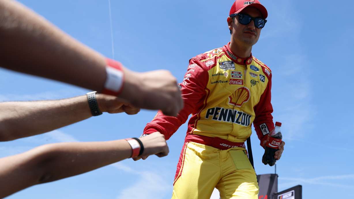 Driver Joey Logano greets fans before a NASCAR Cup Series auto race at Talladega Superspeedway, Sunday, April 27, 2025, in Talladega, Ala.