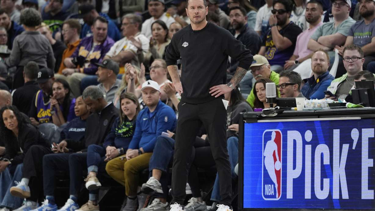 Los Angeles Lakers head coach JJ Redick watches play during the first half of Game 4 of an NBA basketball first-round playoff series against the Minnesota Timberwolves, Sunday, April 27, 2025, in Minneapolis.