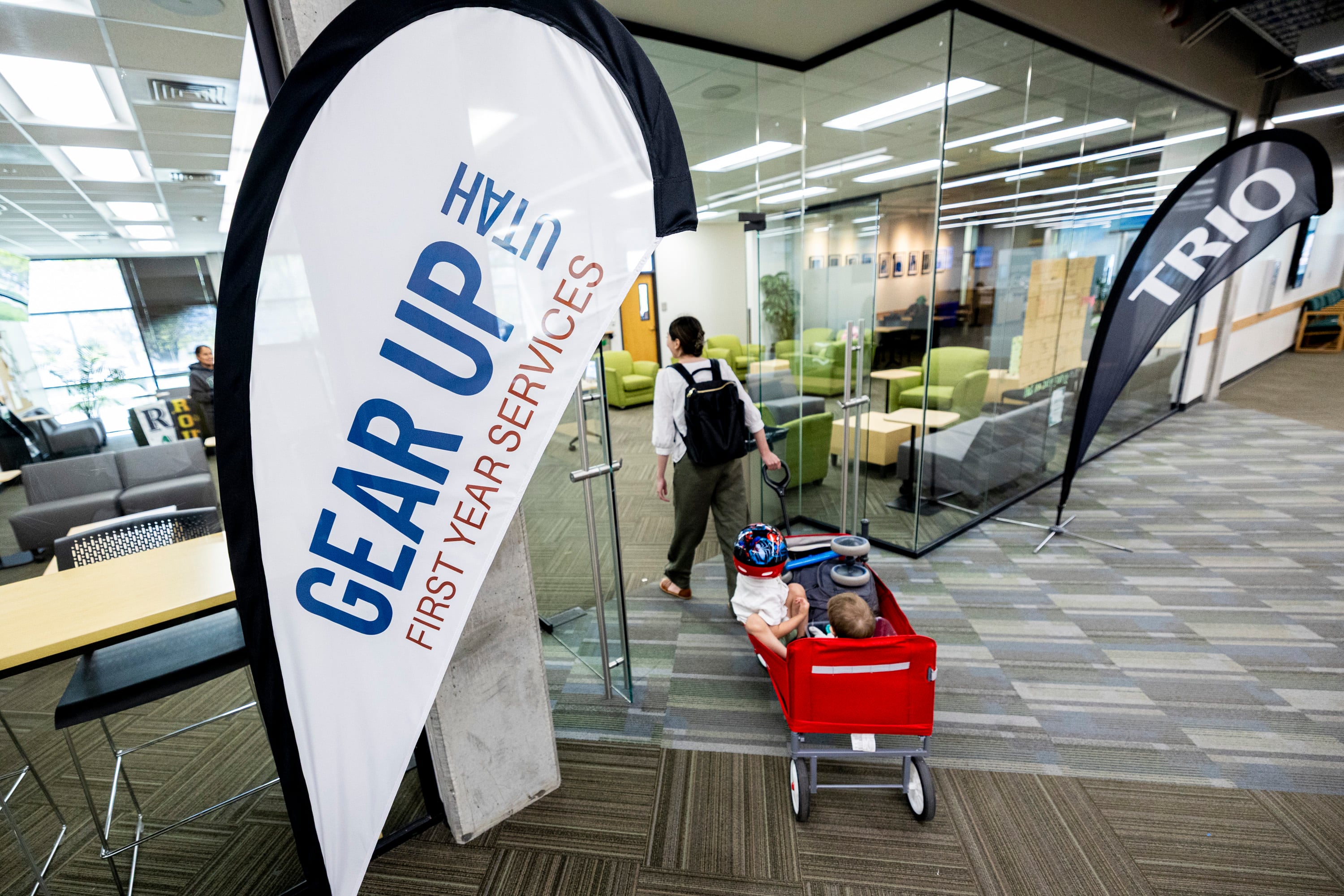 Michelle Jackson, a rising senior studying accounting, walks into the First-Generation Student Success Center with her sons Jason, 2, and Damian, 9 months, on the campus of Utah Valley University in Orem on Tuesday, April 29, 2025.