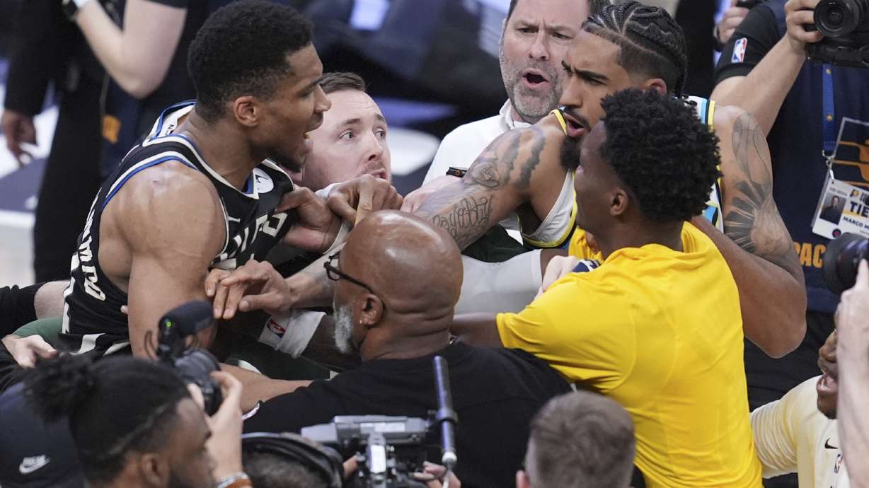 Milwaukee Bucks forward Giannis Antetokounmpo, left, is separated from Indiana Pacers players forward Obi Toppin, second from right, and guard Bennedict Mathurin, right, after Game 5 of an NBA basketball first-round playoff series in Indianapolis, Tuesday, April 29, 2025.