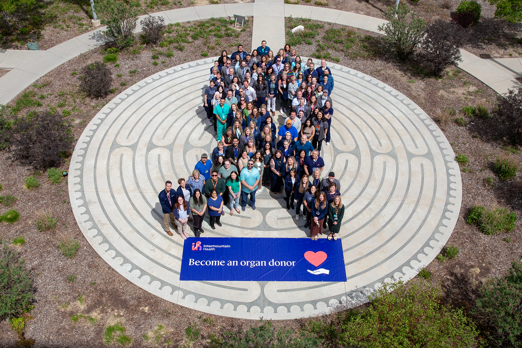 A group photo of caregivers and patients is taken at an Intermountain Health event on April 23 to advocate for organ donation and thank caregivers and patients.