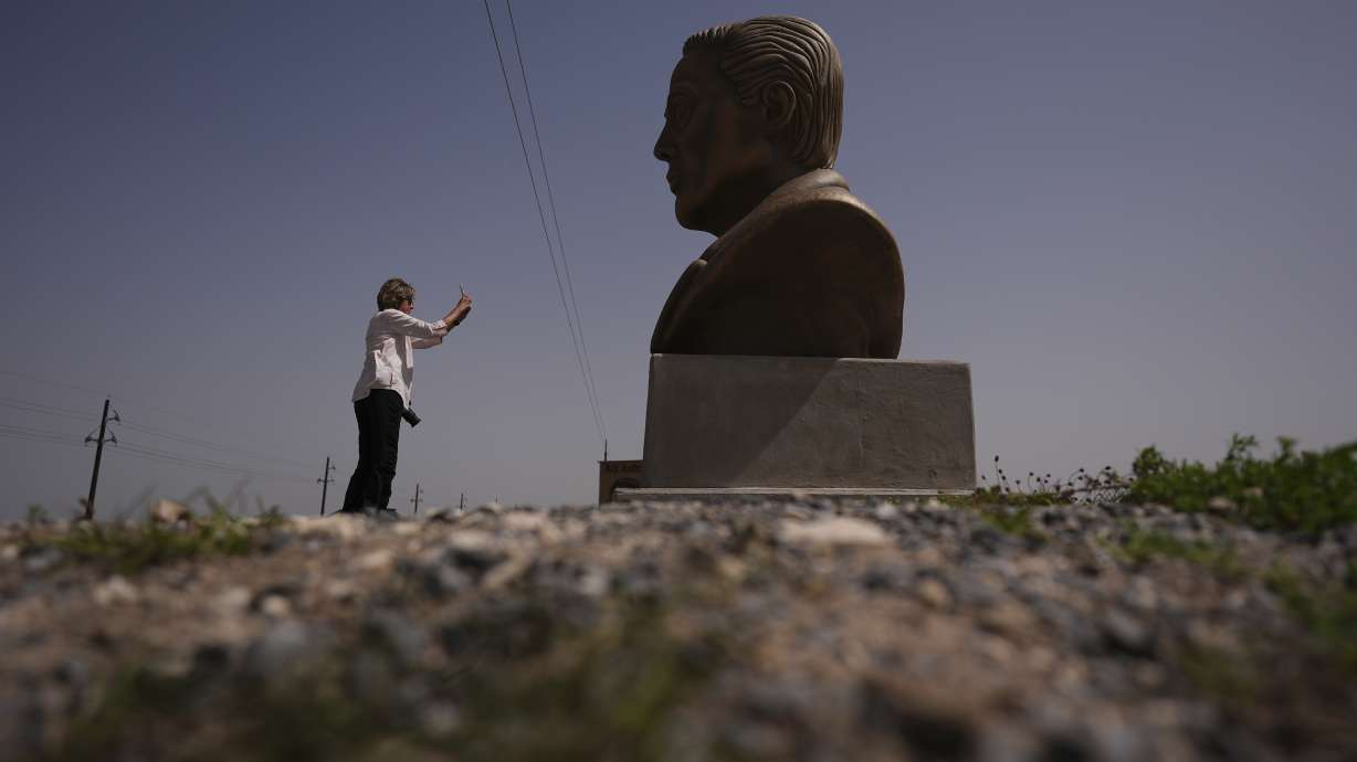 A visitor photographs a large bust of Elon Musk before a test flight in Boca Chica, Texas, March 5. The home of SpaceX could become a city called Starbase.
