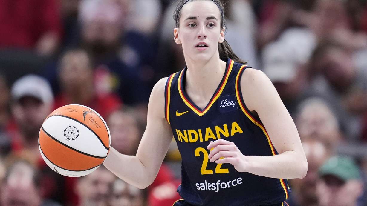 FILE - Indiana Fever guard Caitlin Clark (22) plays against the Dallas Wings in the second half of a WNBA basketball game in Indianapolis, Sunday, Sept. 15, 2024.