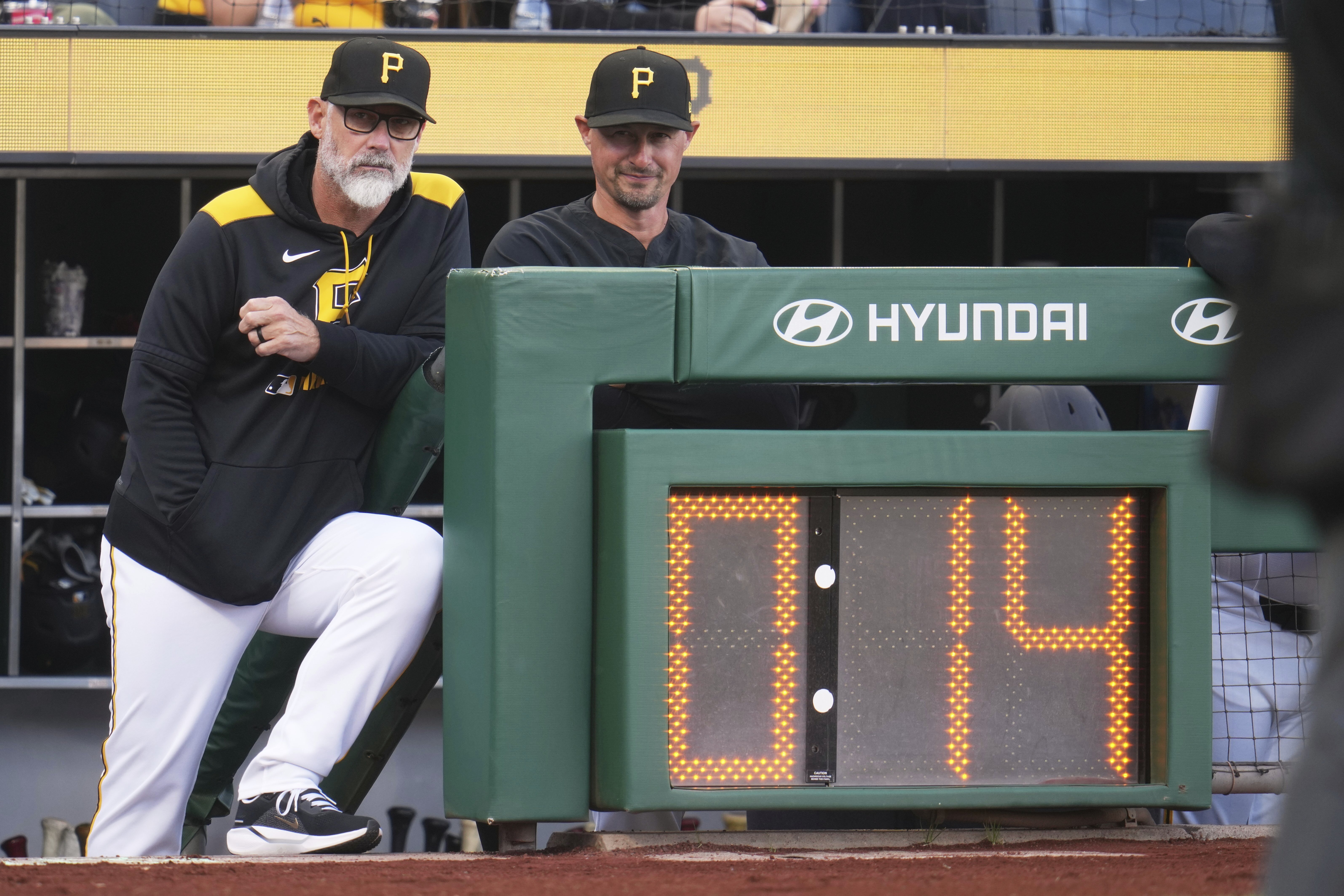 Pittsburgh Pirates manager Derek Shelton, left, and bench coach Don Kelly stand in the dugout during a baseball game against the Chicago Cubs in Pittsburgh, Wednesday, April 30, 2025.