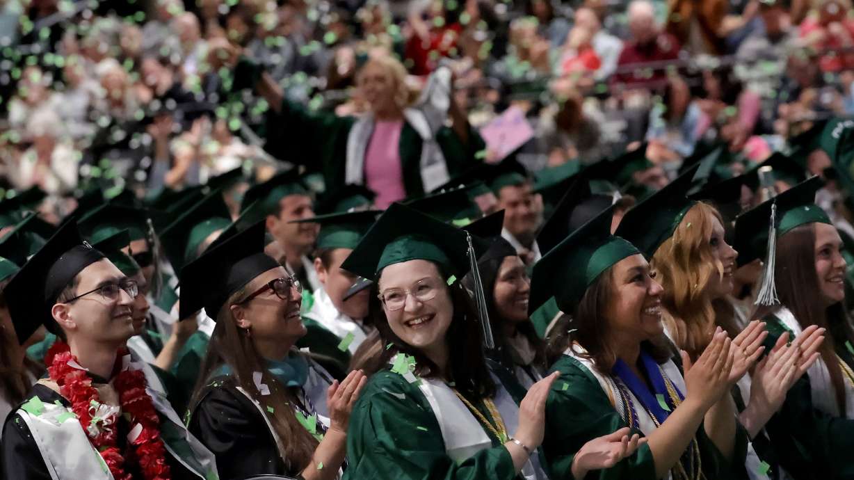 Utah Valley University graduates applaud at the 2025 commencement ceremony in the UCCU Center at Utah Valley University in Orem on Wednesday.