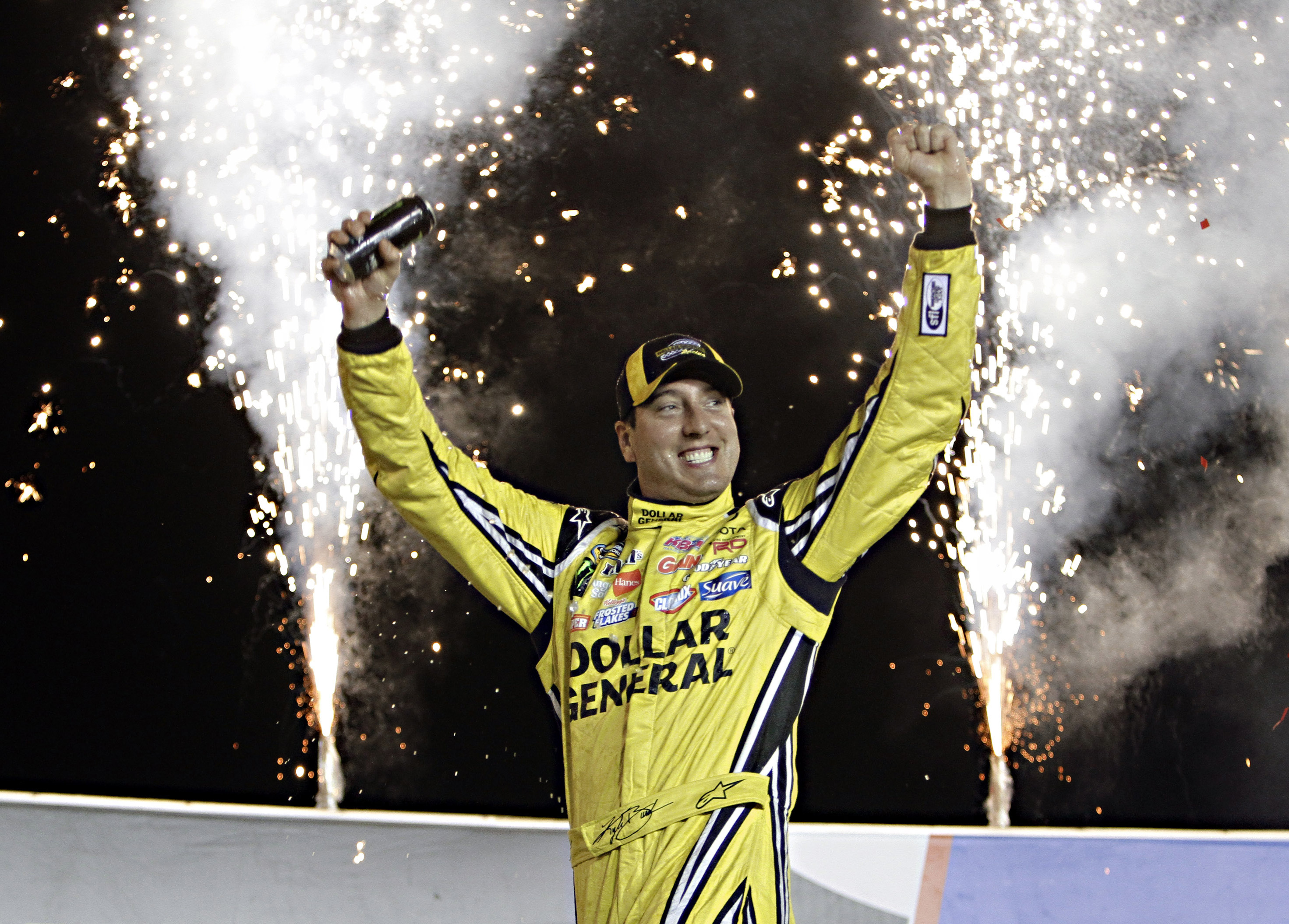 FILE - Kyle Busch celebrates in Victory Circle after winning the NASCAR Trucks auto race at Kentucky Speedway in Sparta, Ky., June 26, 2014.