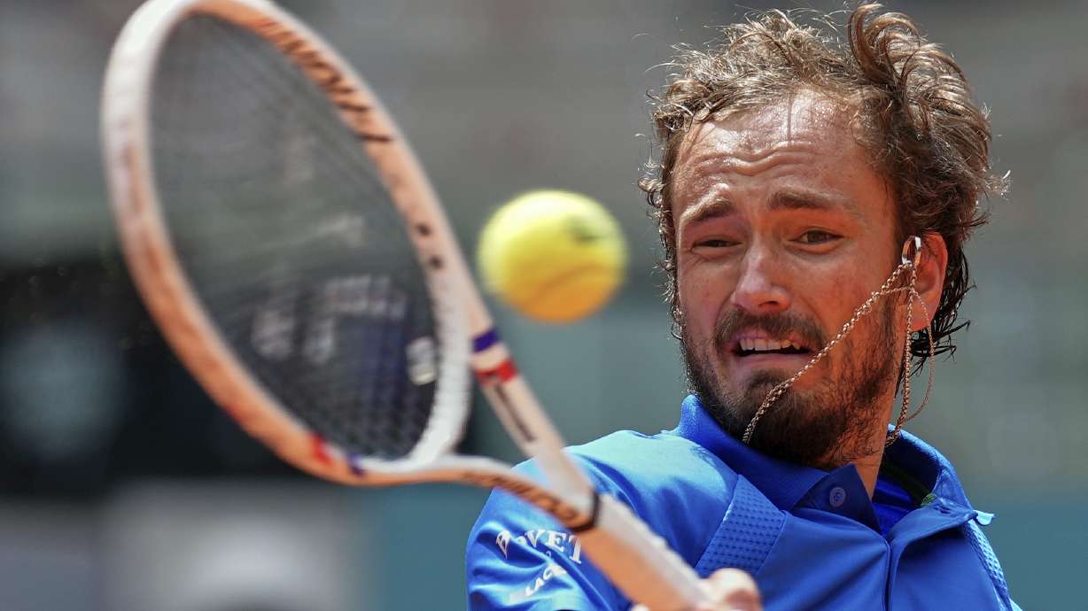 Russia's Daniil Medvedev returns the ball against Casper Ruud of Norway during the Madrid Open tennis tournament in Madrid, Spain, Thursday, May 1, 2025.