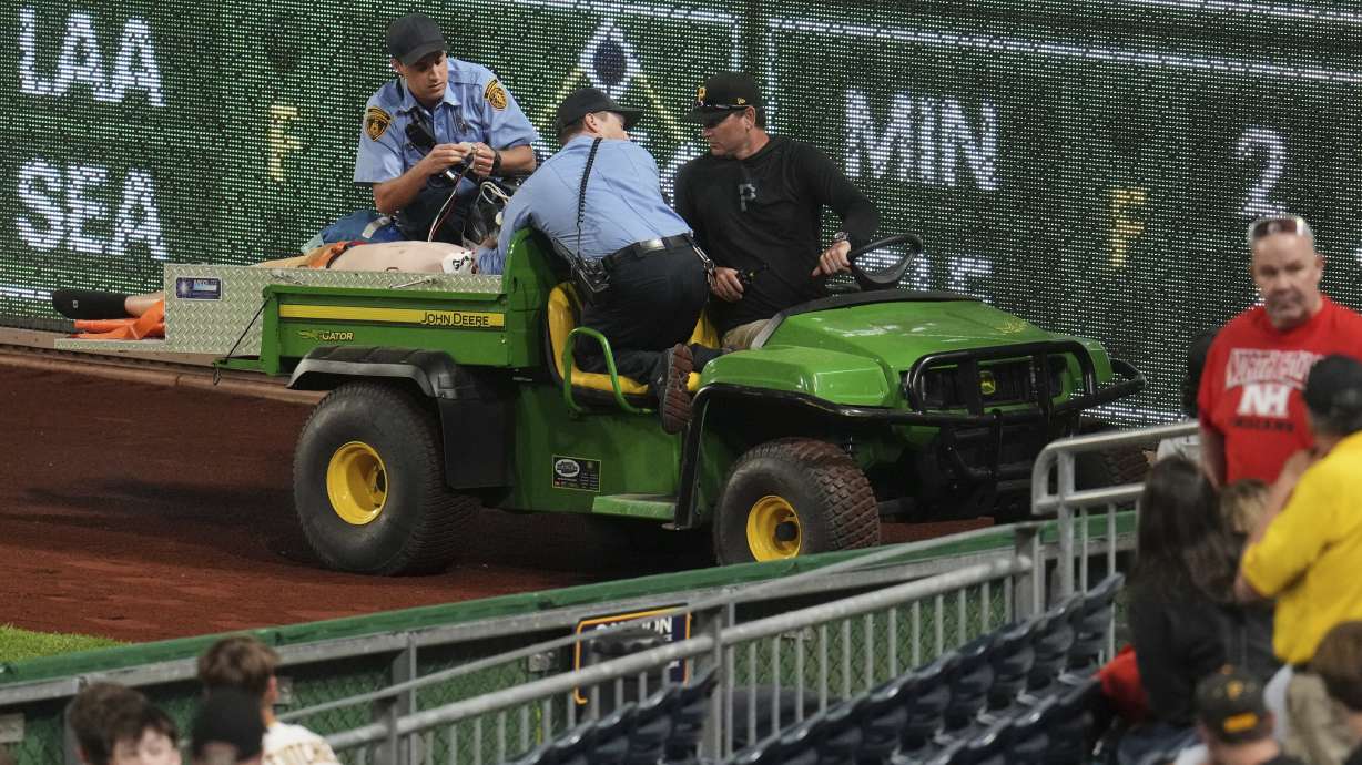 A fan is carted off the field at PNC Park after falling out of the stands during the seventh inning of a baseball game between the Pittsburgh Pirates and the Chicago Cubs in Pittsburgh, Wednesday, April 30, 2025.