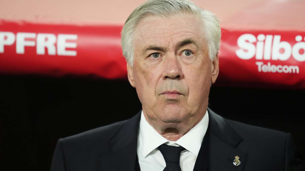 Real Madrid's head coach Carlo Ancelotti waits for the start of the Spanish Copa del Rey final soccer match between Barcelona and Real Madrid at Estadio de La Cartuja stadium in Seville, Spain, Saturday, April 26, 2025.
