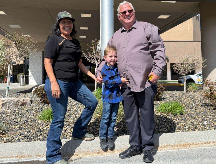Kim and Curtis Wormsbaker stand with Dylan Wormabaker’s son, their grandson Sawyer, at the organ donation event on Wednesday in Idaho Falls.