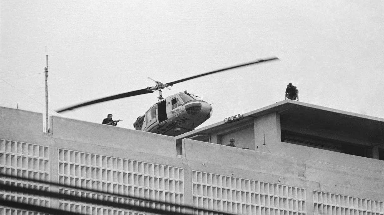 A U.S. Marine helicopter takes off from helipad on top of the American Embassy in Saigon, Vietnam, April 30, 1975.