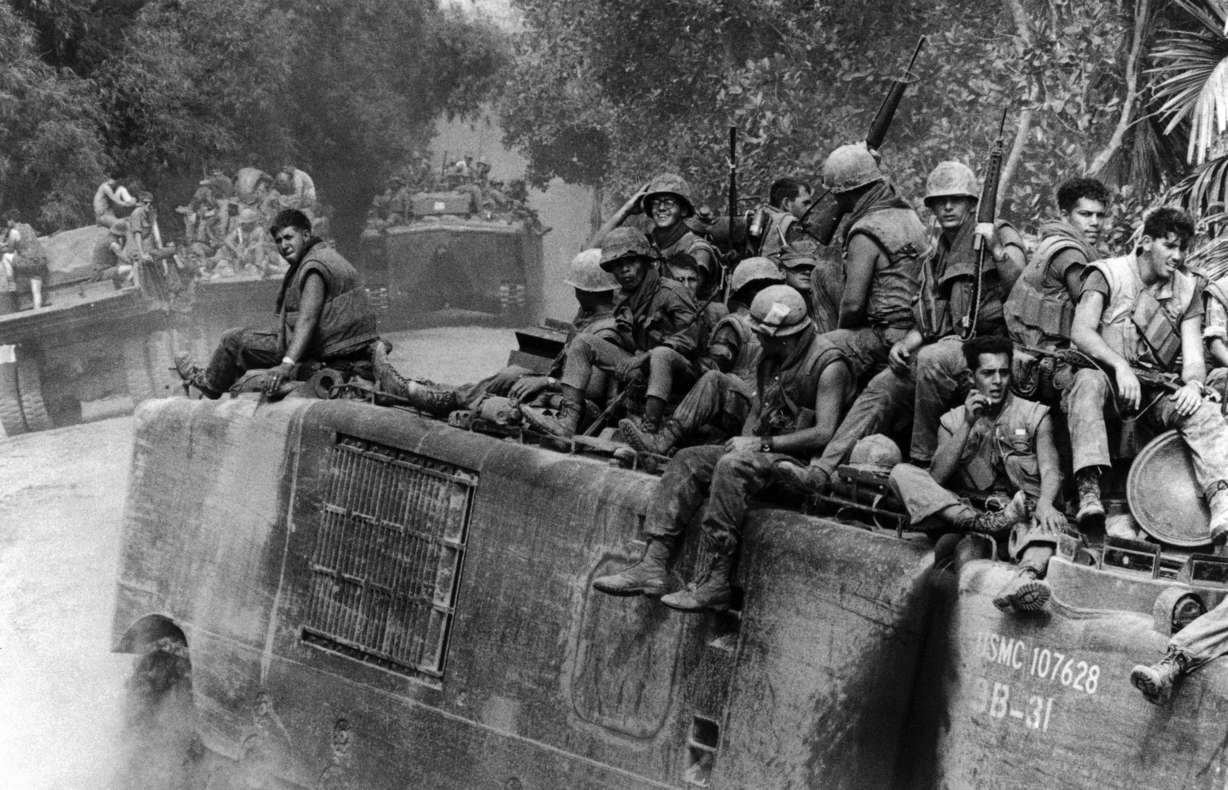 An amphibious tracked vehicle with a load of fully-armed Marines approaches a river southwest of Danang, South Vietnam, Aug. 22, 1969.