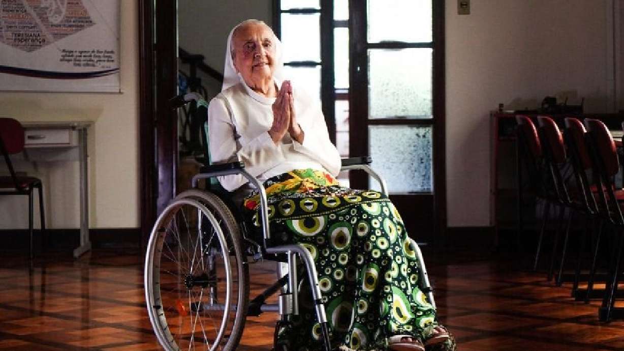 Sister Inah Canabarro, 115, puts her hands together in prayer in Porto Alegre, Brazil, Feb. 16, 2024. Canabarro died Wednesday.