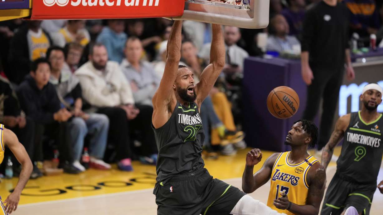 Minnesota Timberwolves center Rudy Gobert (27) dunks over Los Angeles Lakers forward Dorian Finney-Smith (17) during the first half in Game 5 of an NBA basketball first-round playoff series Wednesday, April 30, 2025, in Los Angeles.
