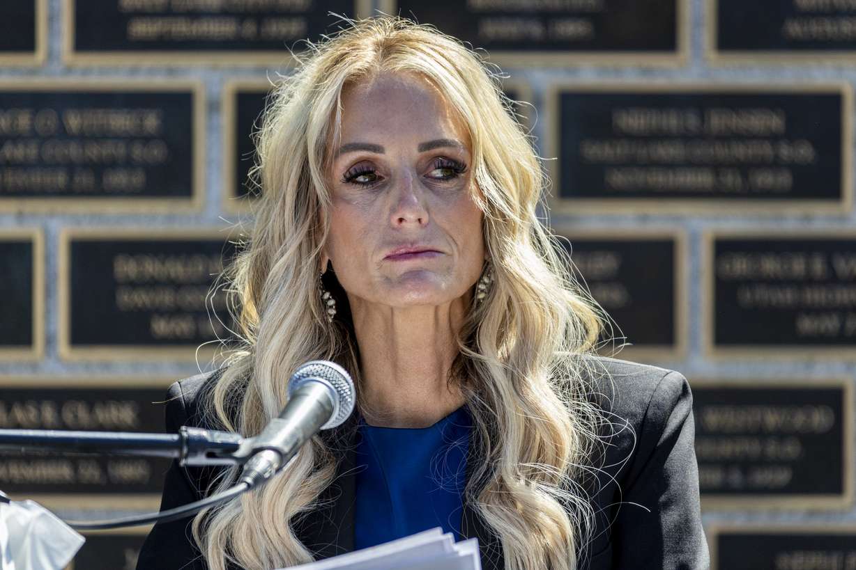 Kinda Hooser, wife of the late Santaquin Police Sgt. Billy D. Hooser, speaks during the annual Utah Police Memorial Service held at the Utah Law Enforcement Memorial outside the Capitol in Salt Lake City on Thursday.