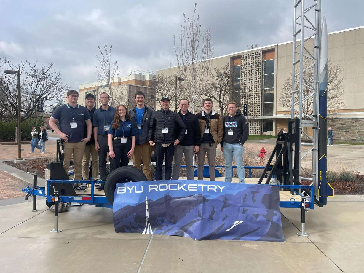 BYU Rocketry Club members pose with a trailer built to launch hybrid rockets.