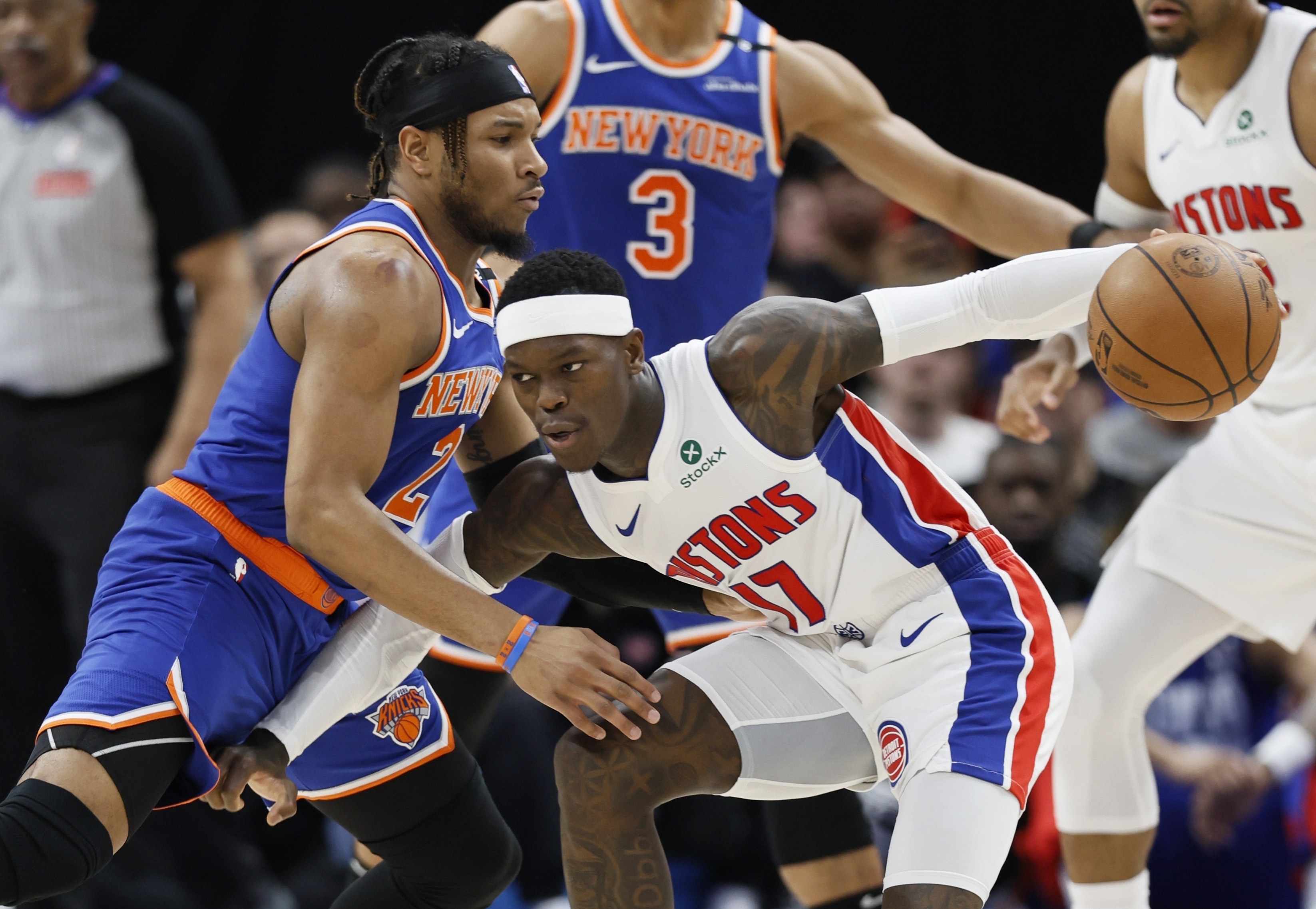 Detroit Pistons guard Dennis Schroder (17) drives against New York Knicks guard Miles McBride (2) during the first half of Game 6 of an NBA basketball first-round playoff series Thursday, May 1, 2025, in Detroit.