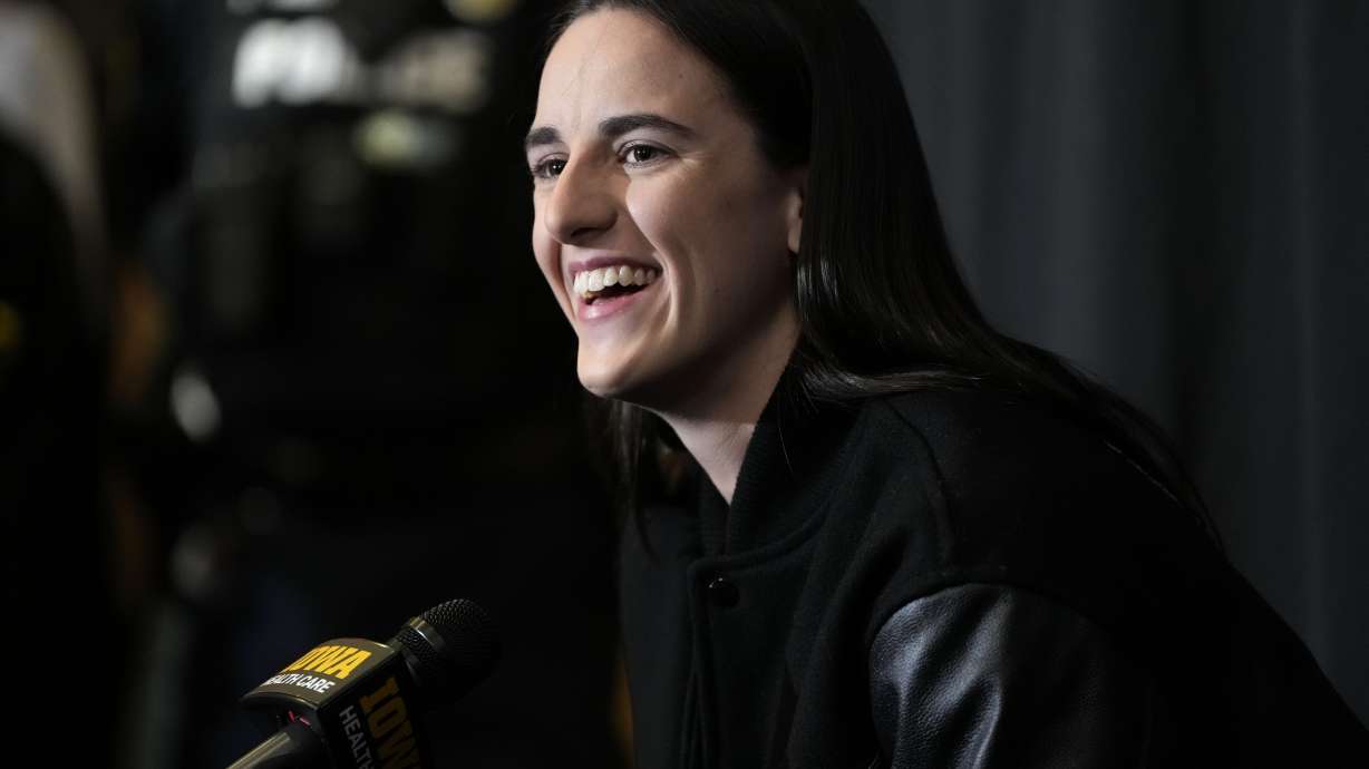 FILE = Former Iowa guard and current Indiana Fever WNBA player Caitlin Clark speaks during a news conference before an NCAA college basketball game between Iowa and USC, Sunday, Feb. 2, 2025, in Iowa City, Iowa.