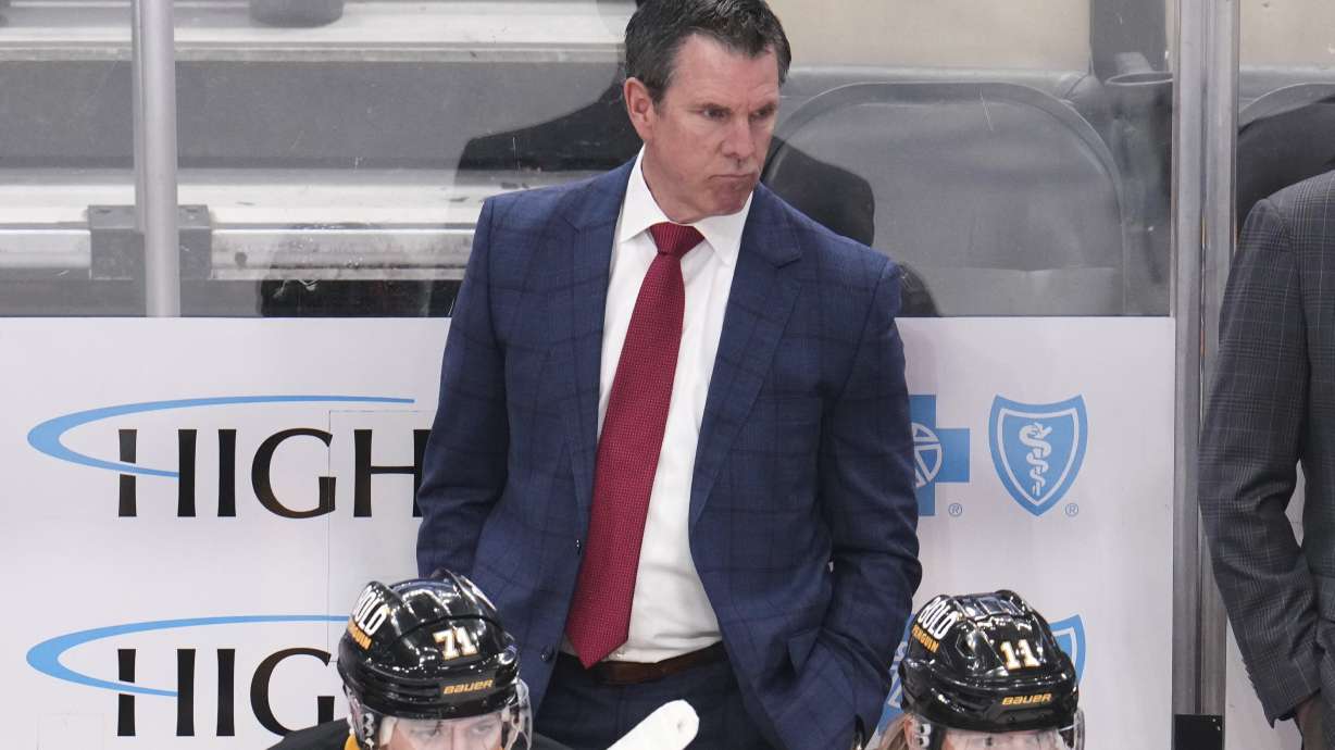 Pittsburgh Penguins head coach Mike Sullivan stands behind his bench during the third period of an NHL hockey game against the Boston Bruins in Pittsburgh, Sunday, April 13, 2025.