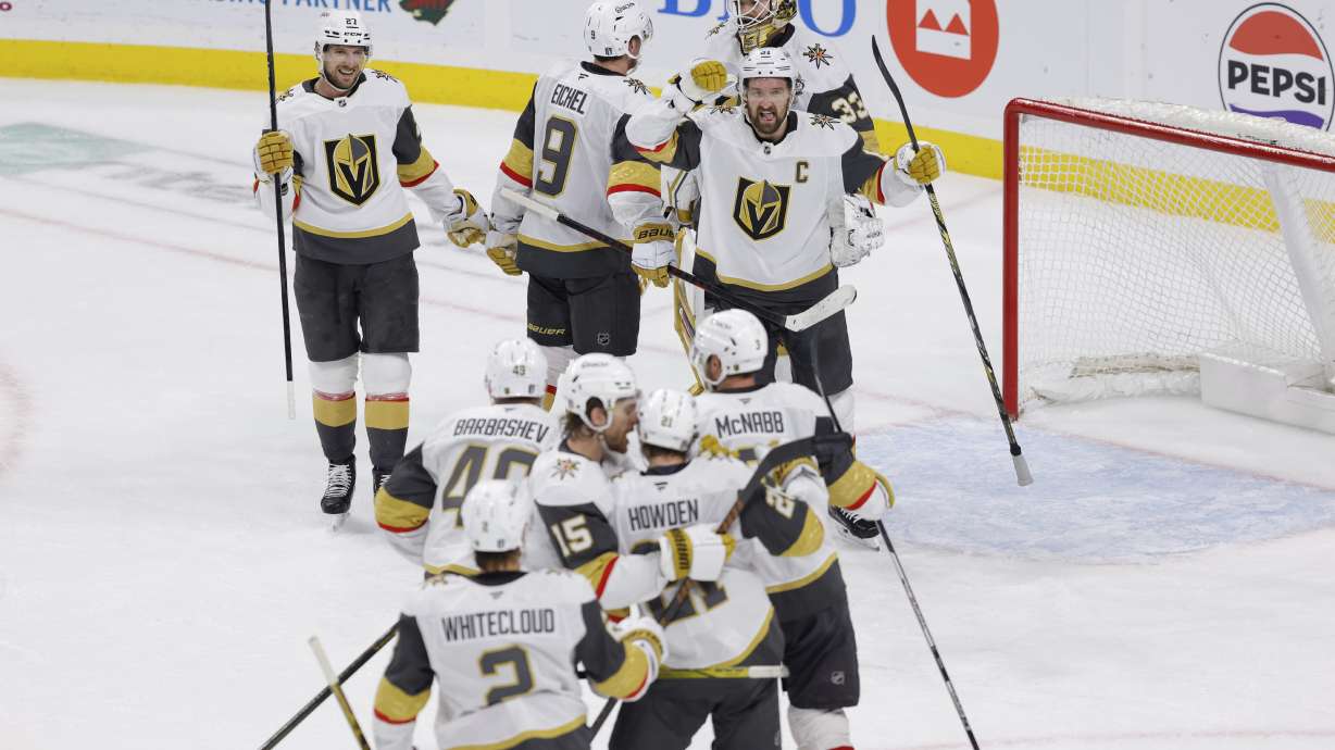 Vegas Golden Knights celebrate after winning Game 6 of a first-round NHL hockey playoff series against the Minnesota Wild, Thursday, May 1, 2025, in St. Paul, Minn.