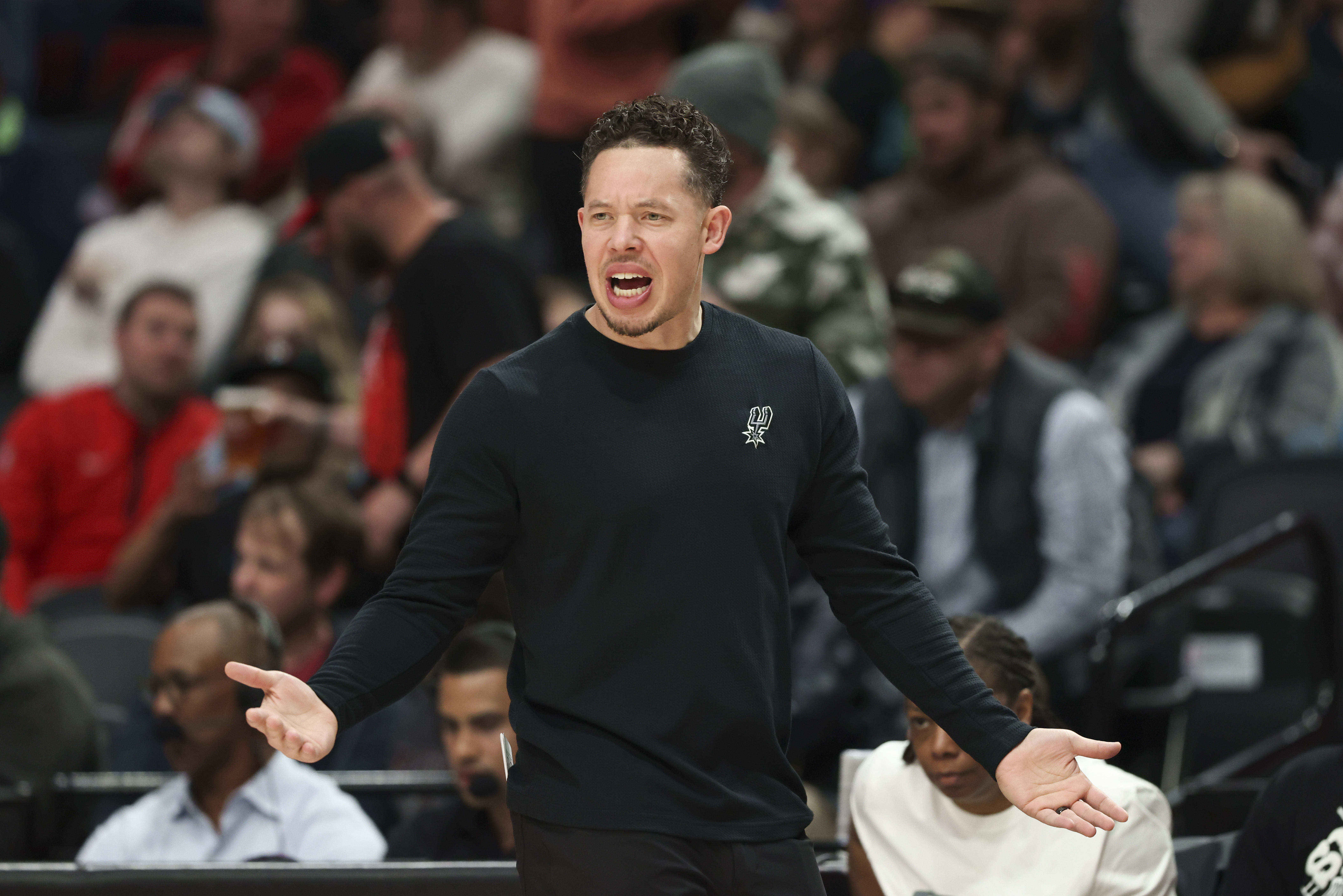 San Antonio Spurs interim head coach Mitch Johnson reacts during the first half of an NBA basketball game against the Portland Trail Blazers, Sunday, April 6, 2025, in Portland, Ore. 
