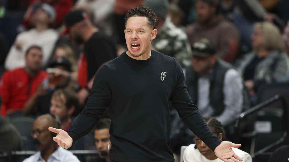 San Antonio Spurs interim head coach Mitch Johnson reacts during the first half of an NBA basketball game against the Portland Trail Blazers, Sunday, April 6, 2025, in Portland, Ore.