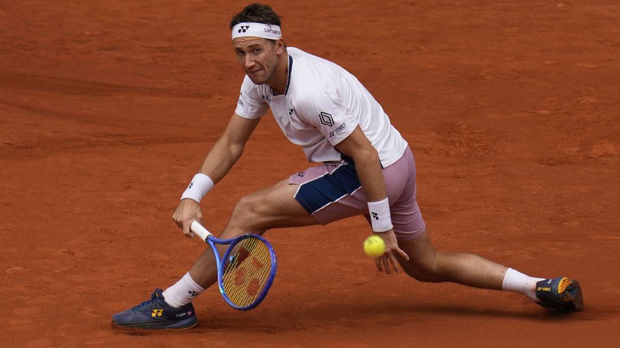Casper Ruud of Norway returns the ball against Francisco Cerundolo from Argentina during men's semifinal at the Madrid Open tennis tournament in Madrid, Spain, Friday, May 2, 2025.