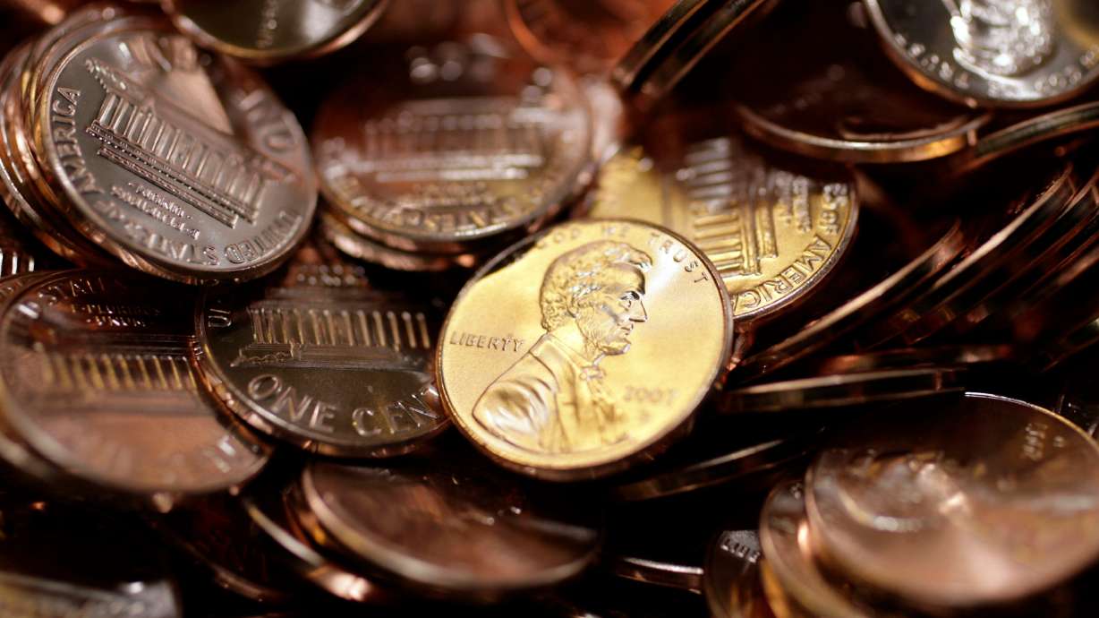 Freshly made pennies sit in a bin at the U.S. Mint in Denver. Sen. Mike Lee, R-Utah, and Sen. Jeff Merkley, D-Ore., have a plan to save American taxpayers millions of dollars, titled the "Make Sense Not Cents Act."