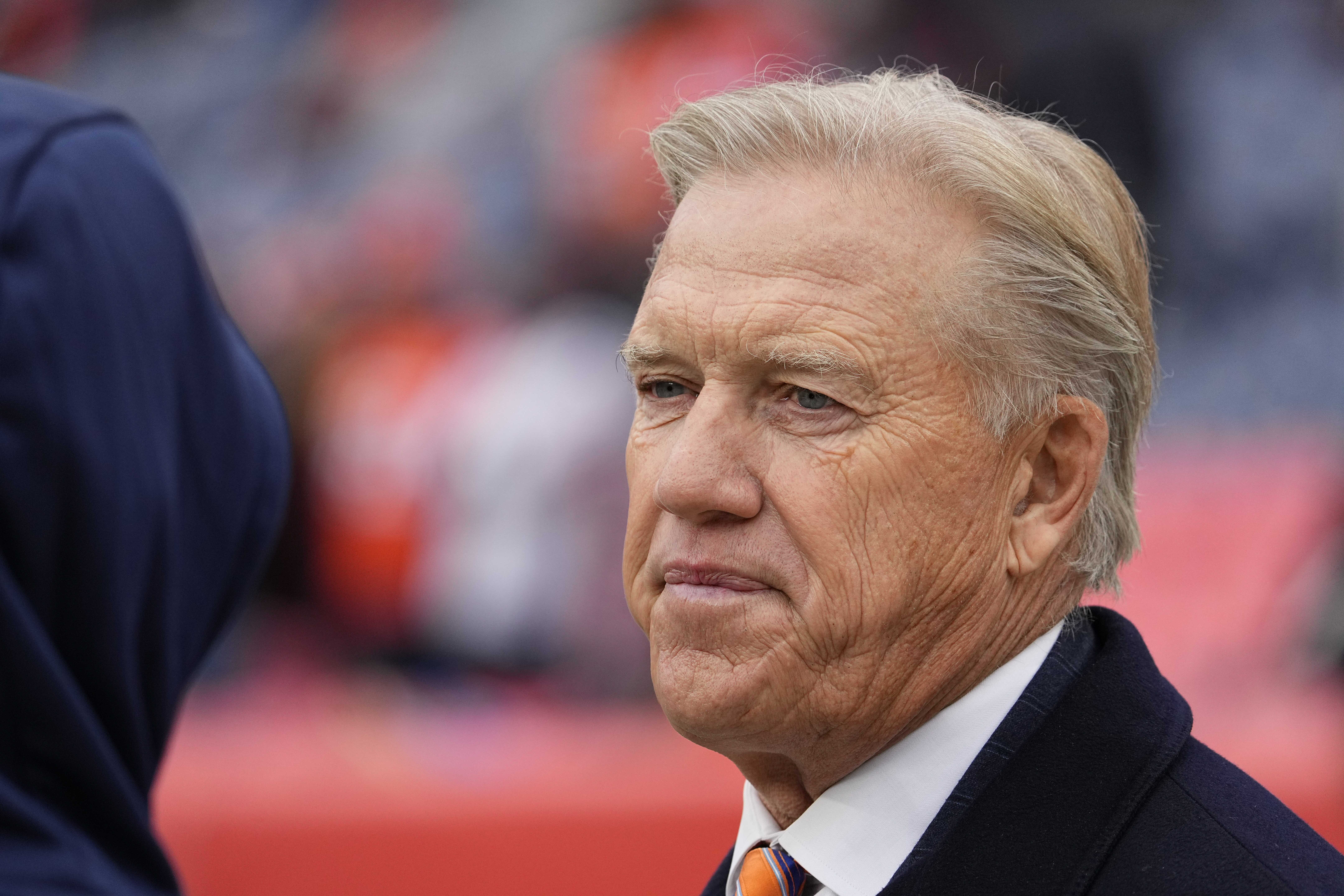 FILE - John Elway, Denver Broncos president of football operations, looks on before an NFL football game against the Washington Football Team, Oct. 31, 2021, in Denver.