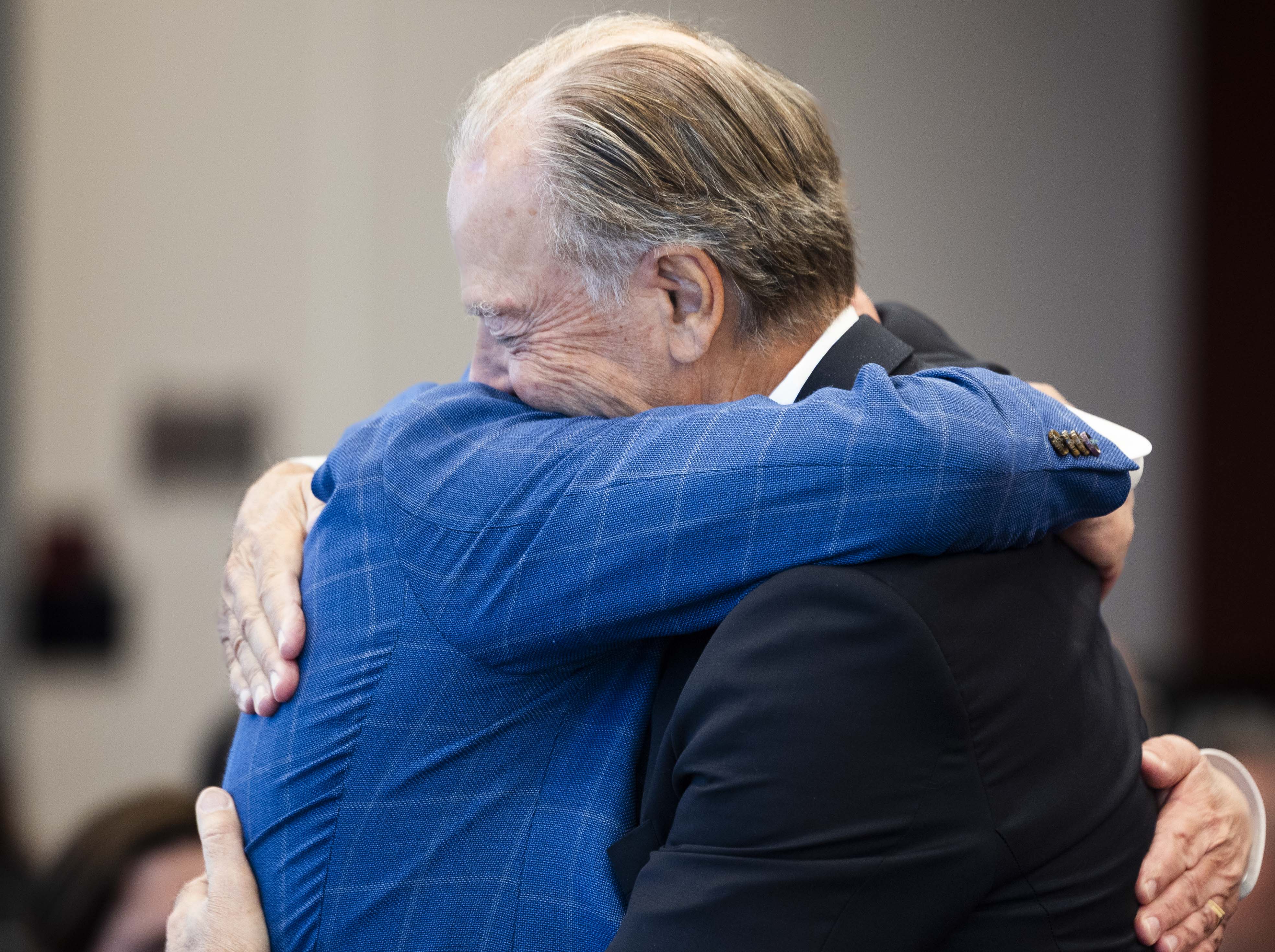 Pierre Lassonde and Troy D'Ambrosio, chief of staff and vice president for innovation at the University of Utah, hug each other during a ceremony celebrating a donation by the Lassonde family of $25 million to the Lassonde Entrepreneur Institute in Salt Lake City on Friday.