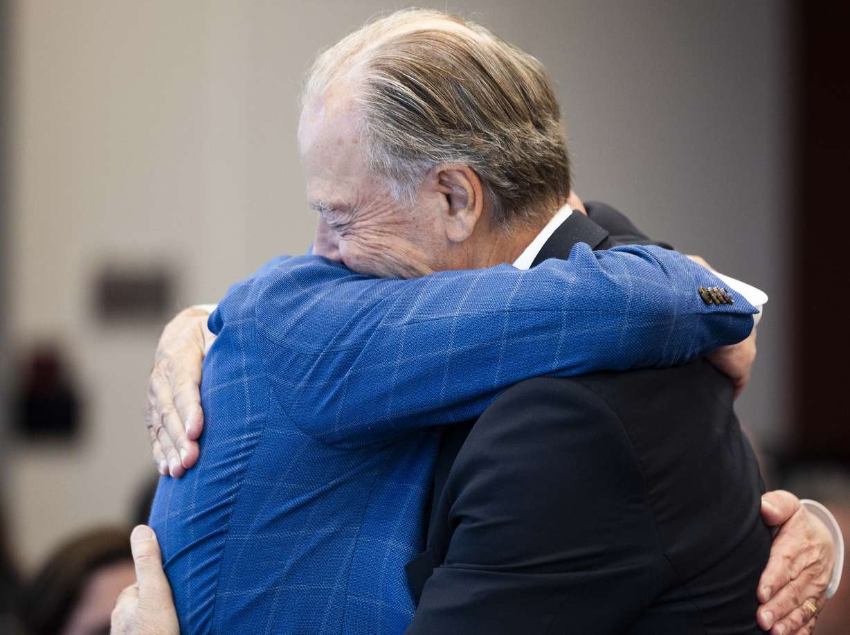 Pierre Lassonde and Troy D'Ambrosio, chief of staff and vice president for innovation at the University of Utah, hug each other during a ceremony celebrating a donation by the Lassonde family of $25 million to the Lassonde Entrepreneur Institute in Salt Lake City on Friday.