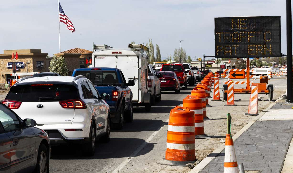 Cars pass through a construction zone connected to a project to widen 1800 North in Sunset on April 15. The Utah Department of Transportation has announced 152 new construction projects worth $1.68 billion, with another 145 already in progress.