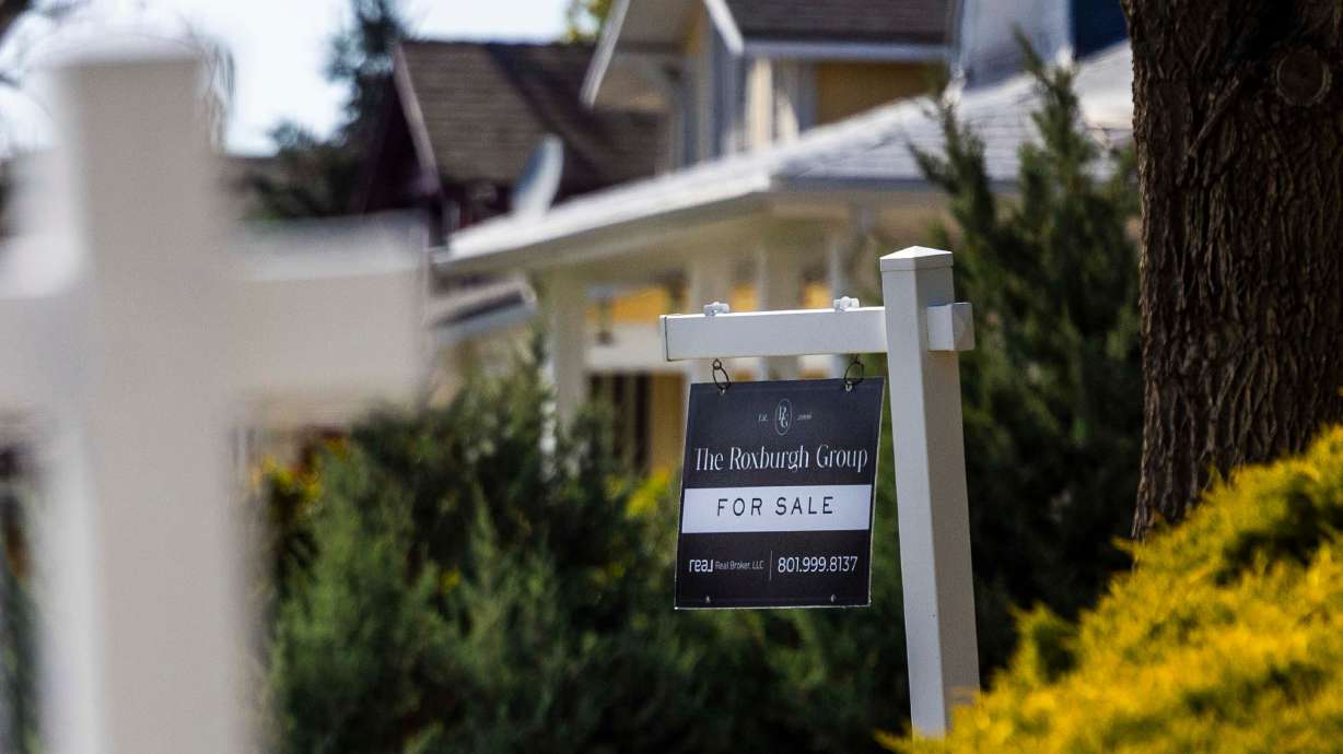 A for-sale sign sits outside a home in Salt Lake City on April 22. The median U.S. monthly mortgage payment reached a record $2,870 last month, thanks to continuing increases in home prices and high mortgage rates, according to new data from Redfin.