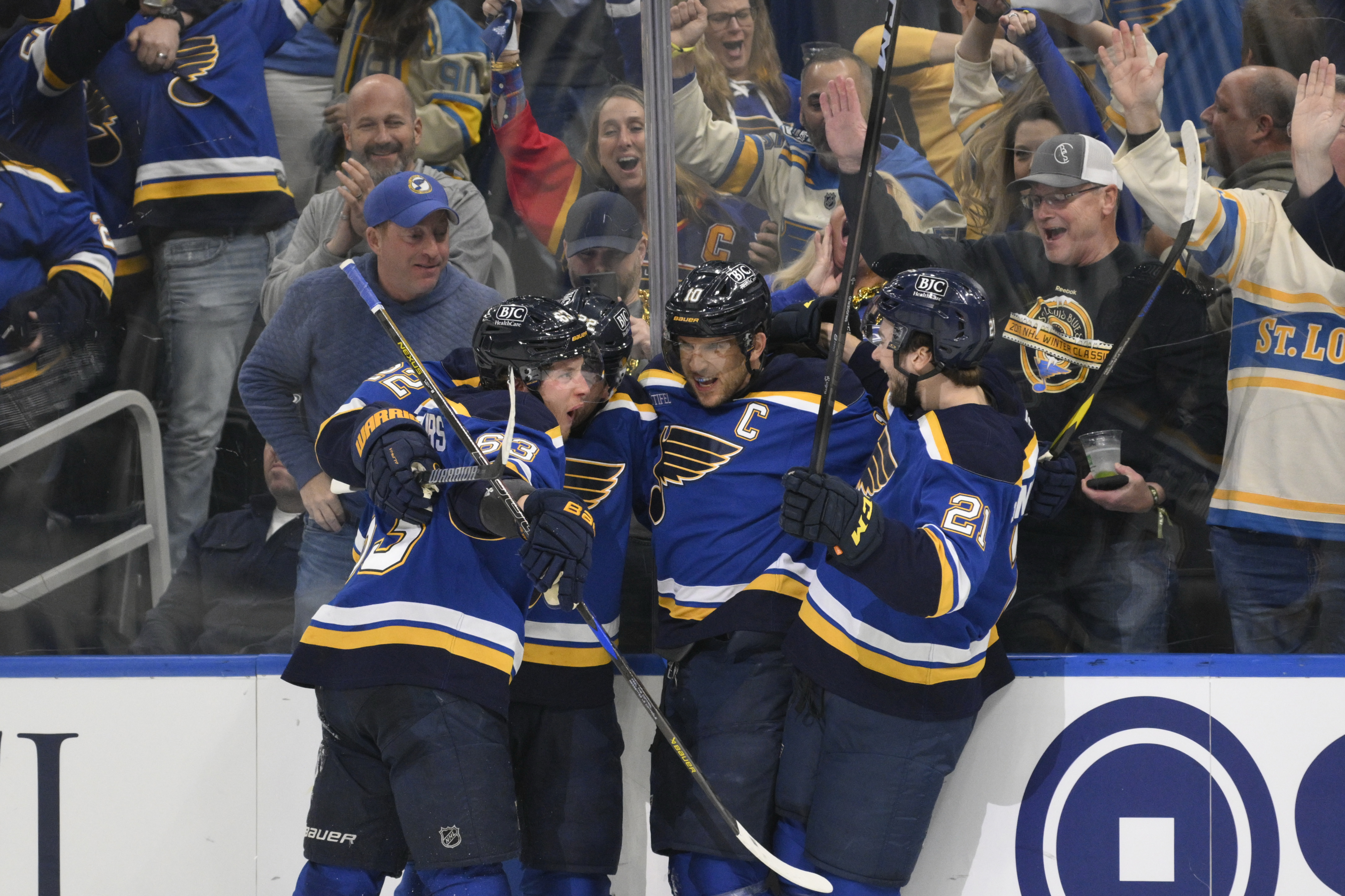 St. Louis Blues center Brayden Schenn (10) celebrates with teammates after scoring against the Winnipeg Jets during the second period in Game 6 of an NHL hockey first-round playoff series Friday, May 2, 2025, in St. Louis.