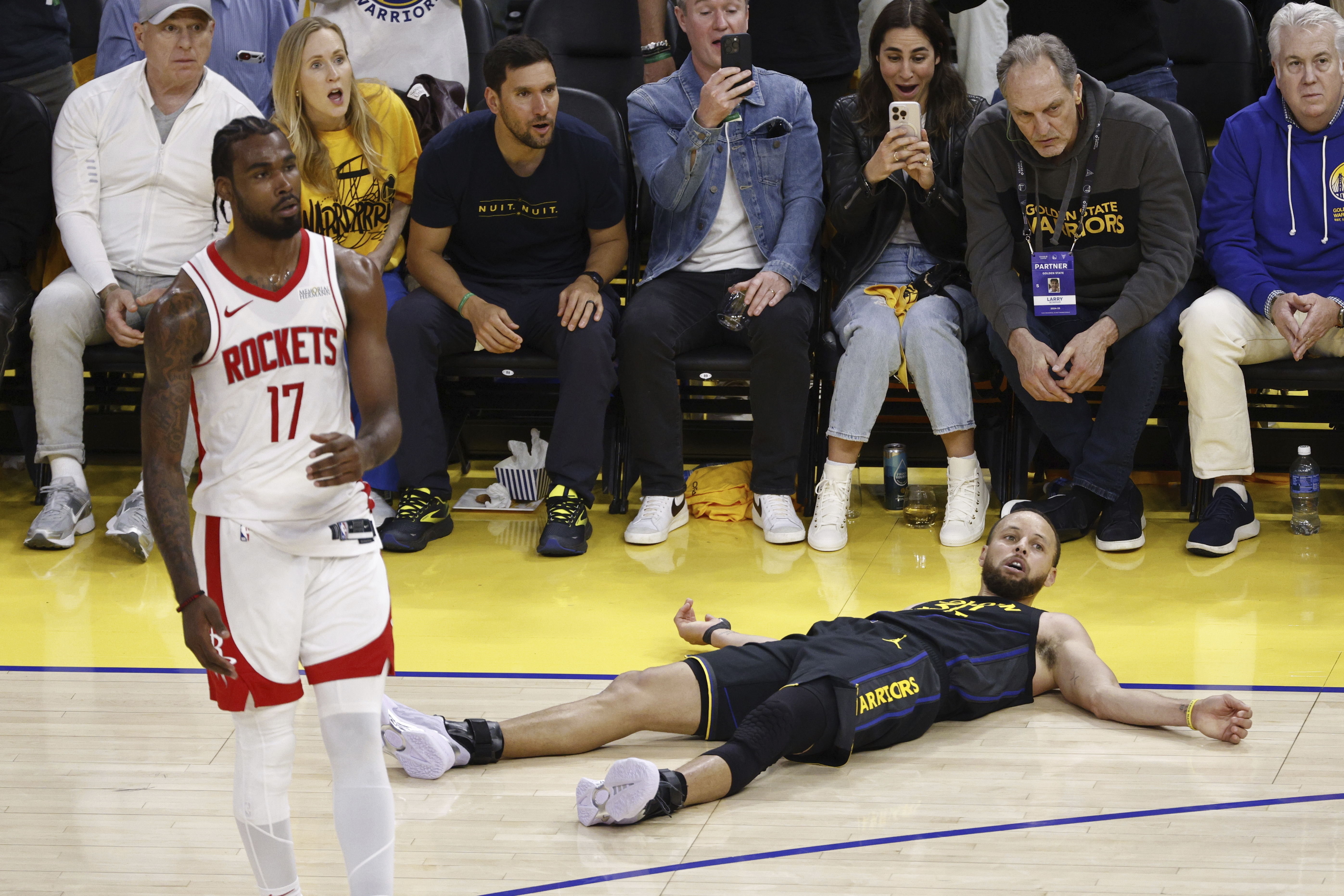 On his three-point attempt, Golden State Warriors guard Stephen Curry (30) is fouled by Houston Rockets forward Tari Eason (17) in the third quarter of Game 6 of an NBA basketball first-round playoff series Friday, May 2, 2025, in San Francisco. 