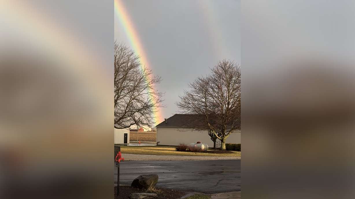 A double rainbow appears to touch down on both sides, including on Kari Rogerson's house in Sugar Grove, Illinois, in March.