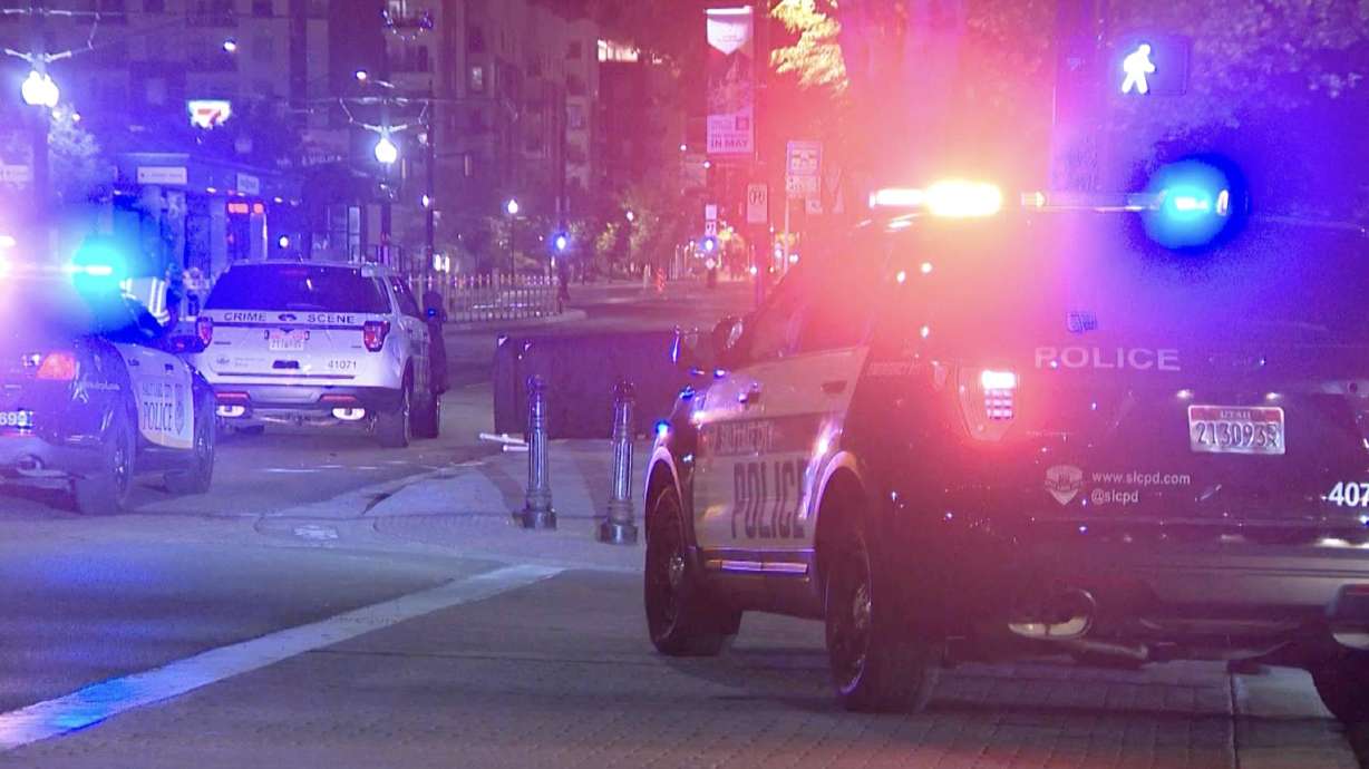 Police investigate the scene of an auto-pedestrian crash at 400 South and 200 East in Salt Lake City after a 41-year-old man was hit and killed by a vehicle early Friday. The driver of the vehicle left the scene, but police say they later found and arrested him.