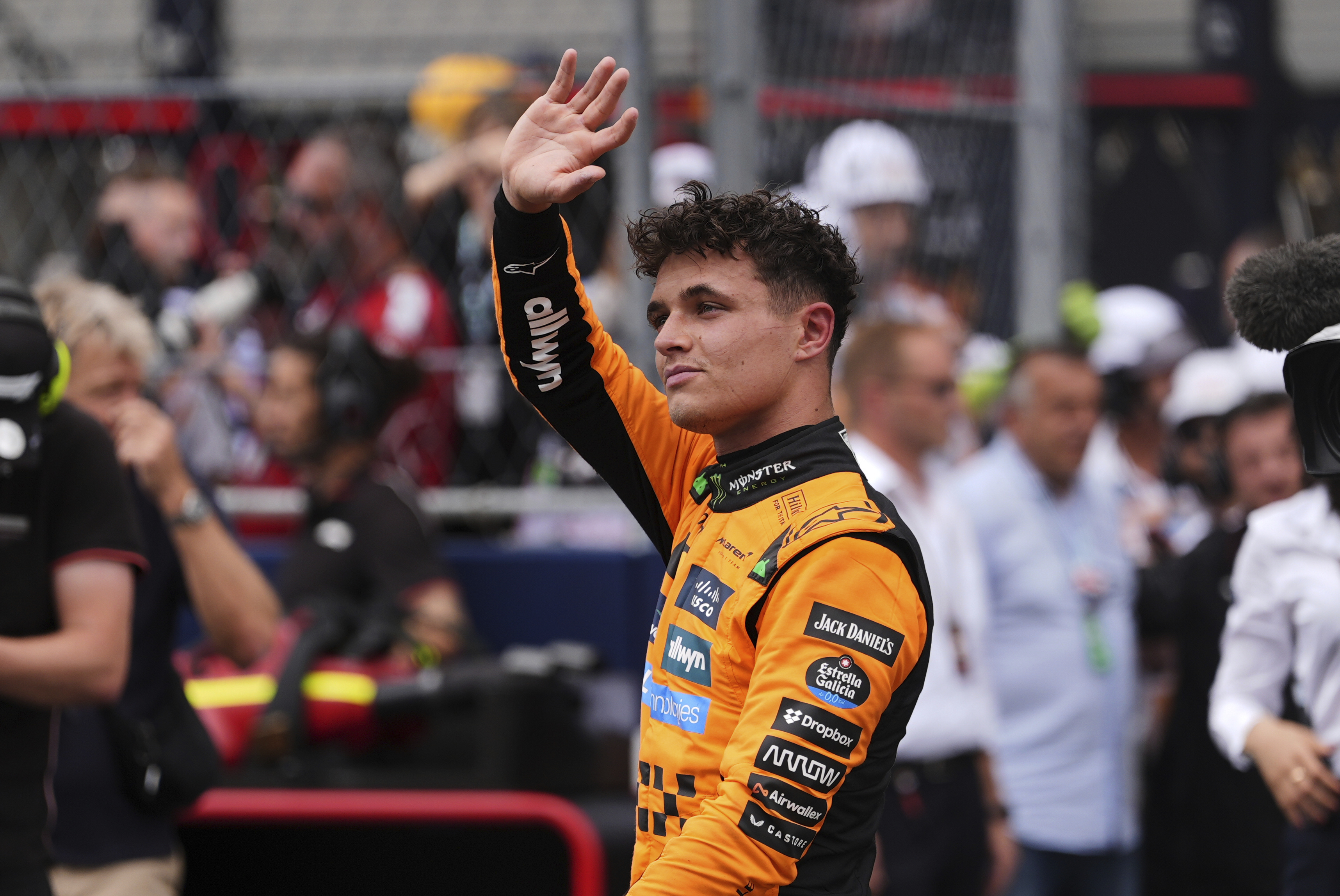 First place finisher McLaren driver Lando Norris of Britain greets the crowd during a trophy ceremony after the Sprint race at the Formula One Miami Grand Prix auto race, Saturday, May 3, 2025, in Miami Gardens, Fla.
