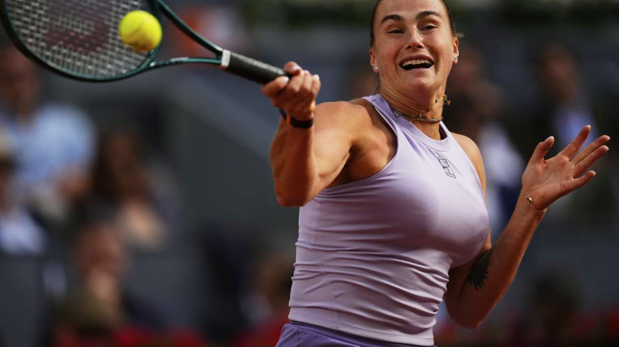Aryna Sabalenka of Belarus returns to United States' Coco Gauff during the Madrid Open tennis final in Madrid, Spain, Saturday, May 3, 2025.